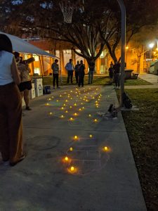 Candles and chalk left on the sidewalk