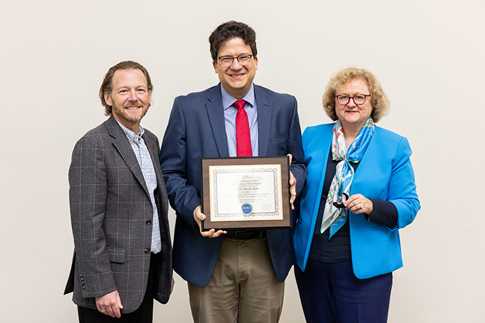 Dr. Rinaldi-Ramos with award