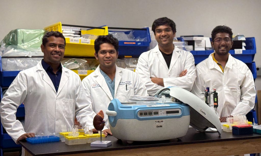 From left, Professor Piyush Jain, surgeon Rushi Shah, Santosh Rananaware and Venkata Vijaya Karthik Narisetty are shown next to a normothermic pump in their CasNx lab in UF Innovate. Photo courtesy of Rushi Shah.